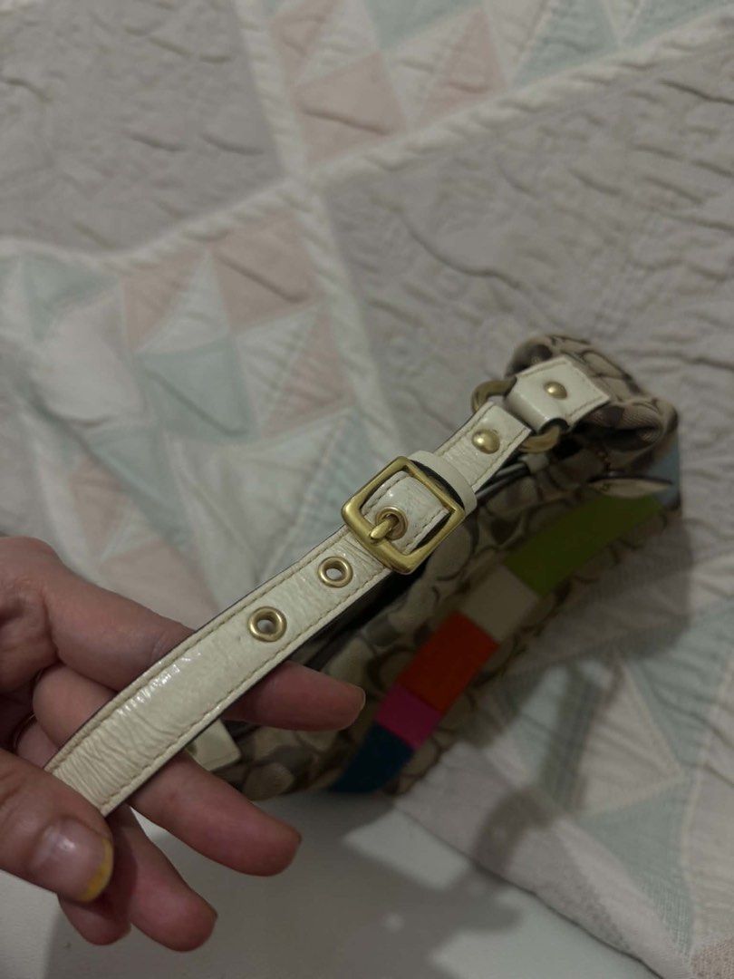 Coach Signature Stripe Patchwork Shoulder Bag from Japan ✨🇯🇵 (Category: Luxury Bags & Wallets) located in Bocaue. Submitted by nhaomiee (Listing ID 1468207864, Image 3). Description: - Authentic Coach signature C jacquard print - Eye-catching colorful leather patchwork stripes along the bottom - Comfortable cream leather adjustable shoulder strap with gold-tone hardware - Vibrant bright pink fabric interior lining - Features creed patch with se