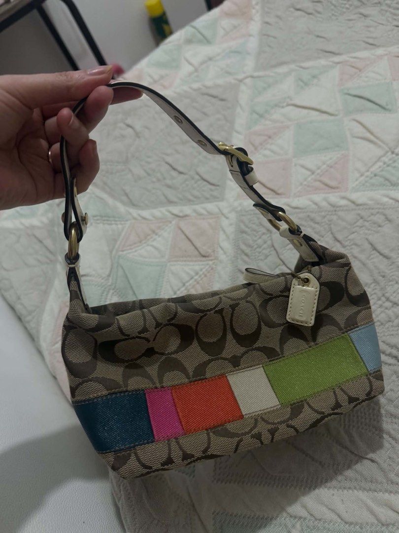 Coach Signature Stripe Patchwork Shoulder Bag from Japan ✨🇯🇵 (Category: Luxury Bags & Wallets) located in Bocaue. Submitted by nhaomiee (Listing ID 1468207864, Image 1). Description: - Authentic Coach signature C jacquard print - Eye-catching colorful leather patchwork stripes along the bottom - Comfortable cream leather adjustable shoulder strap with gold-tone hardware - Vibrant bright pink fabric interior lining - Features creed patch with se