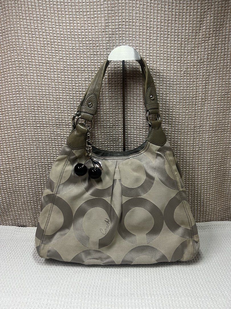 Coach Tote (Category: Shoulder Bags) located in Makati City. Submitted by heyitscesss (Listing ID 1468083725, Image 1). Description: with cherry charm - add 850💗.