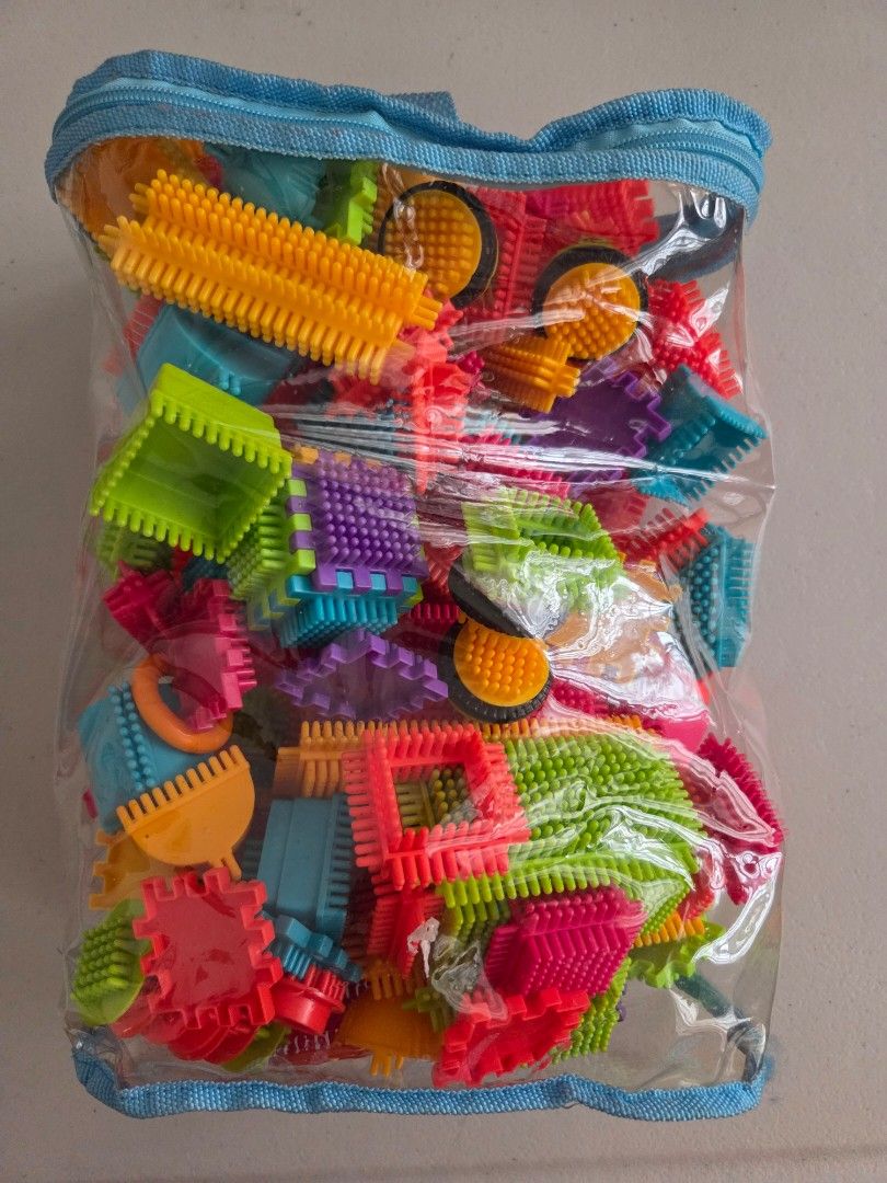 Colorful interlocking bristle blocks sensory construction toy set in bag (Category: Educational & Learning Toys) located in Quezon City. Submitted by robin.t (Listing ID 1468092043, Image 1). Description: - Multi-colored bristle blocks for endless creative building - Excellent tactile sensory toy that helps develop fine motor skills - Includes diverse shapes: squares, wheels, long connector sticks, and arches - Comes with a convenient clear plast