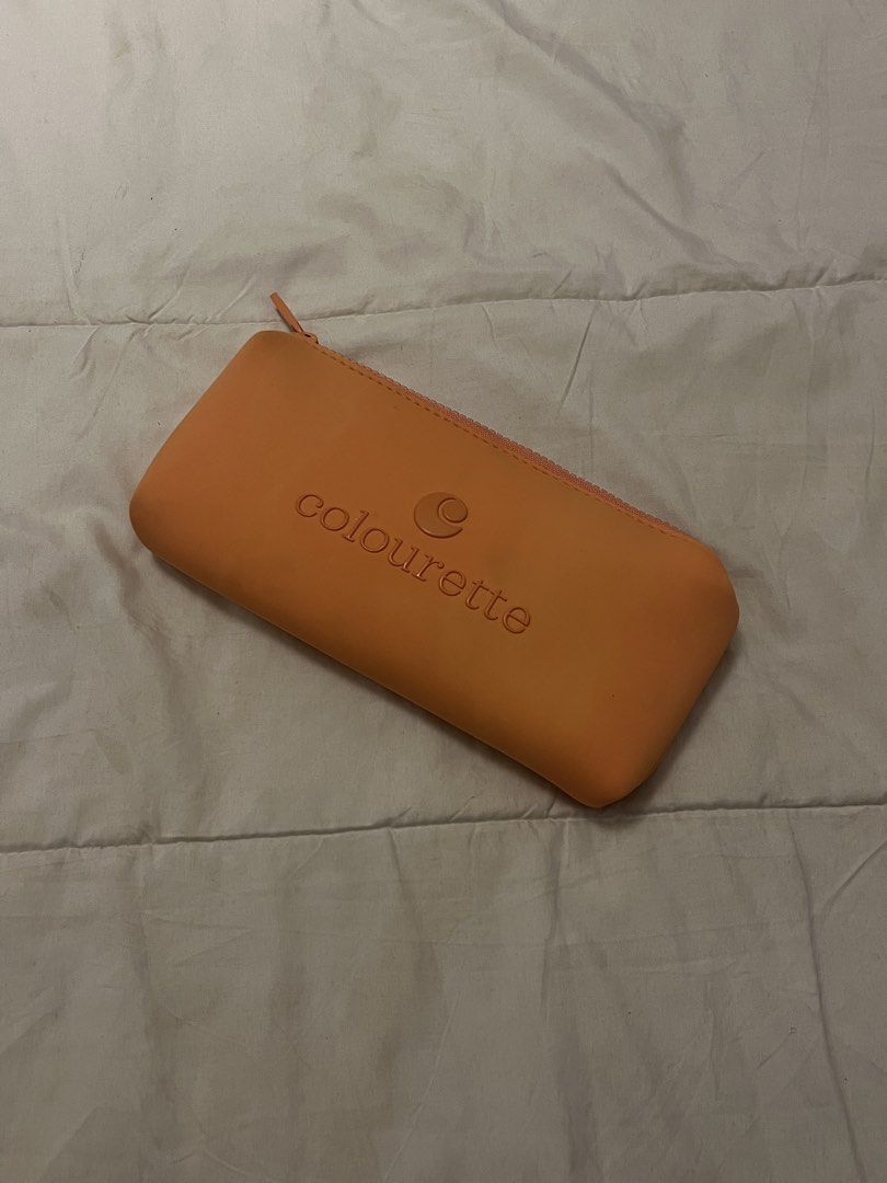Colourette Orange Silicone Cosmetic Pouch (Category: Purses & Pouches) located in Manila. Submitted by beautyarchives (Listing ID 1468201858, Image 1). Description: colourette silicone pouch a cute little pouch for your everyday beauty essentials • vibrant orange color • soft, easy to clean silicone material • top zipper with matching pull tab • embossed colourette logo on the front • perfect for daily makeup essentials and small toiletries • com