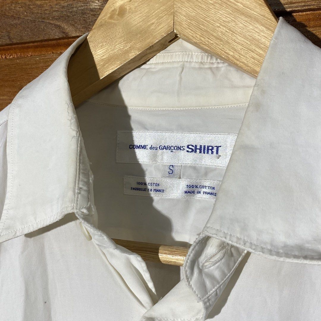 Comme des Garçons Shirt (Category: Shirts) located in Andop. Submitted by rhouzze.ph24 (Listing ID 1468174159, Image 2). Description: OPEN FOR NEGOTIATION Name: Comme des Garçons Dimensions: 23 by 30 Size: Small Issue: Yellow stains on some areas, refer to the photos for the details.