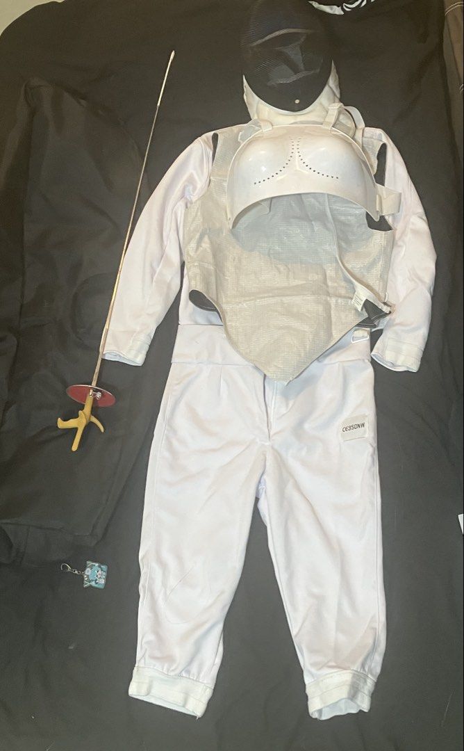 Fencing Set Uniform Foil (Category: Combat Sports) located in Quezon City. Submitted by remmusloveshaon (Listing ID 1468254586, Image 2). Description: - Complete fencing kit ready for practice or competitions - CE350NW-rated white jacket and trousers (size 46) - Foil weapon with distinctive red guard and yellow handle - Fencing mask and metallic vest included - Size M chest protector for safety - Spacious protective gear bag to carry everything -