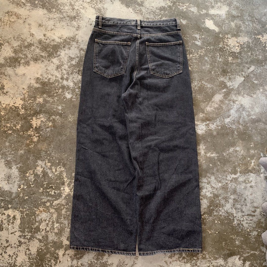 Concrete Black Denim Jeans (Category: Jeans) located in Abucay. Submitted by castoffsfinds (Listing ID 1468136436, Image 2). Description: - Brand: Concrete - Color: Dark washed black - Fit: Wide leg - Material: Heavyweight denim - Details: Contrast stitching and paneled construction - Features: Classic five-pocket styling with button fly and branded interior waistband tag.