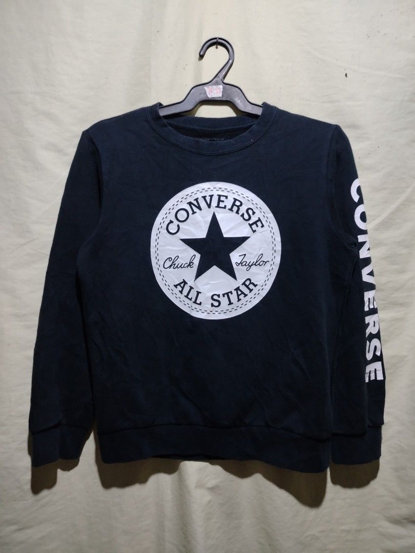 Converse Chuck Taylor All Star Black Sweatshirt (Category: Coats, Jackets and Outerwear) located in Caloocan City. Submitted by vincefresn21903 (Listing ID 1468281809, Image 1). Description: - Brand: Converse - Style: Crewneck sweatshirt - Size: M - Color: Black - Material: Cotton blend with soft fleece lining - Design: Big Chuck Taylor All Star logo on chest and Converse lettering down the left sleeve - Condition: Great for casual everyday wear 