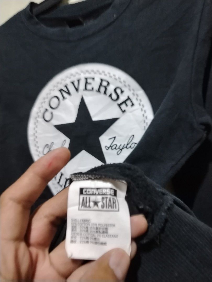 Converse Chuck Taylor All Star Black Sweatshirt (Category: Coats, Jackets and Outerwear) located in Caloocan City. Submitted by vincefresn21903 (Listing ID 1468281809, Image 3). Description: - Brand: Converse - Style: Crewneck sweatshirt - Size: M - Color: Black - Material: Cotton blend with soft fleece lining - Design: Big Chuck Taylor All Star logo on chest and Converse lettering down the left sleeve - Condition: Great for casual everyday wear 