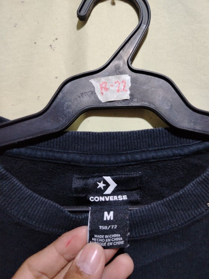 Converse Chuck Taylor All Star Black Sweatshirt (Category: Coats, Jackets and Outerwear) located in Caloocan City. Submitted by vincefresn21903 (Listing ID 1468281809, Image 2). Description: - Brand: Converse - Style: Crewneck sweatshirt - Size: M - Color: Black - Material: Cotton blend with soft fleece lining - Design: Big Chuck Taylor All Star logo on chest and Converse lettering down the left sleeve - Condition: Great for casual everyday wear 