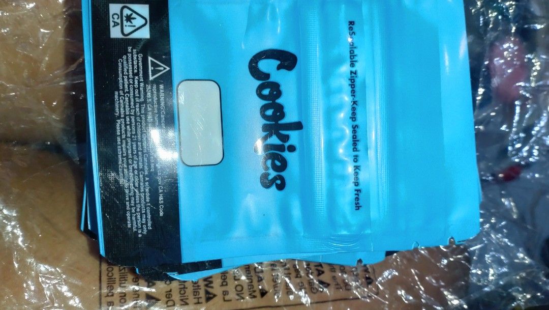 Cookies ziplock pouch 19pcs. (Category: Packaged & Instant Food) located in Valenzuela. Submitted by diane.35 (Listing ID 1468098698, Image 3). Description: - Vibrant blue design with branding and back warning text - Secure zip seal to lock in freshness - Resealable durable mylar material - Ideal for small items, crafts, or product samples - Multiple pieces included per pack.