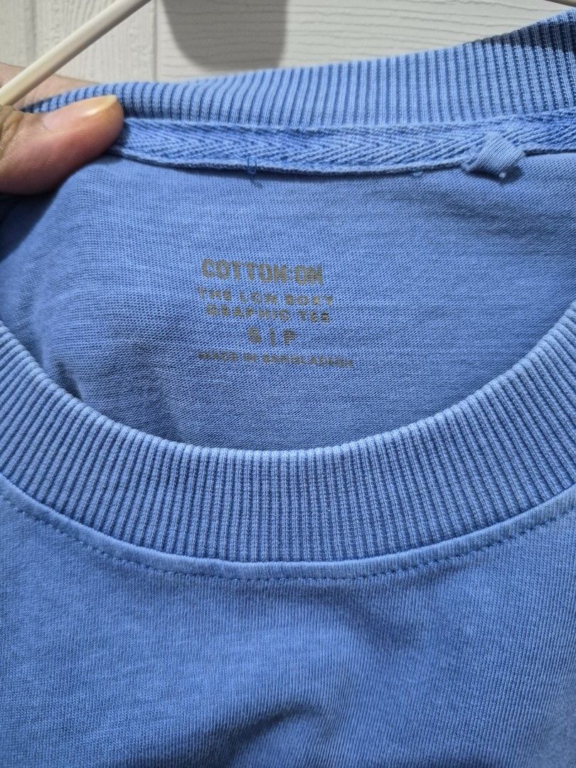 Cotton On Nirvana Graphic Tee Blue Size S (Category: Tshirts & Polo Shirts ) located in Antipolo. Submitted by prinsesa_dianne (Listing ID 1468247293, Image 3). Description: Cotton On boxy graphic tee in blue. Nirvana text and smiley face print on the front. Ribbed crew neck collar. Size S tag printed inside the collar. Made in Bangladesh. Comfortable everyday casual shirt..