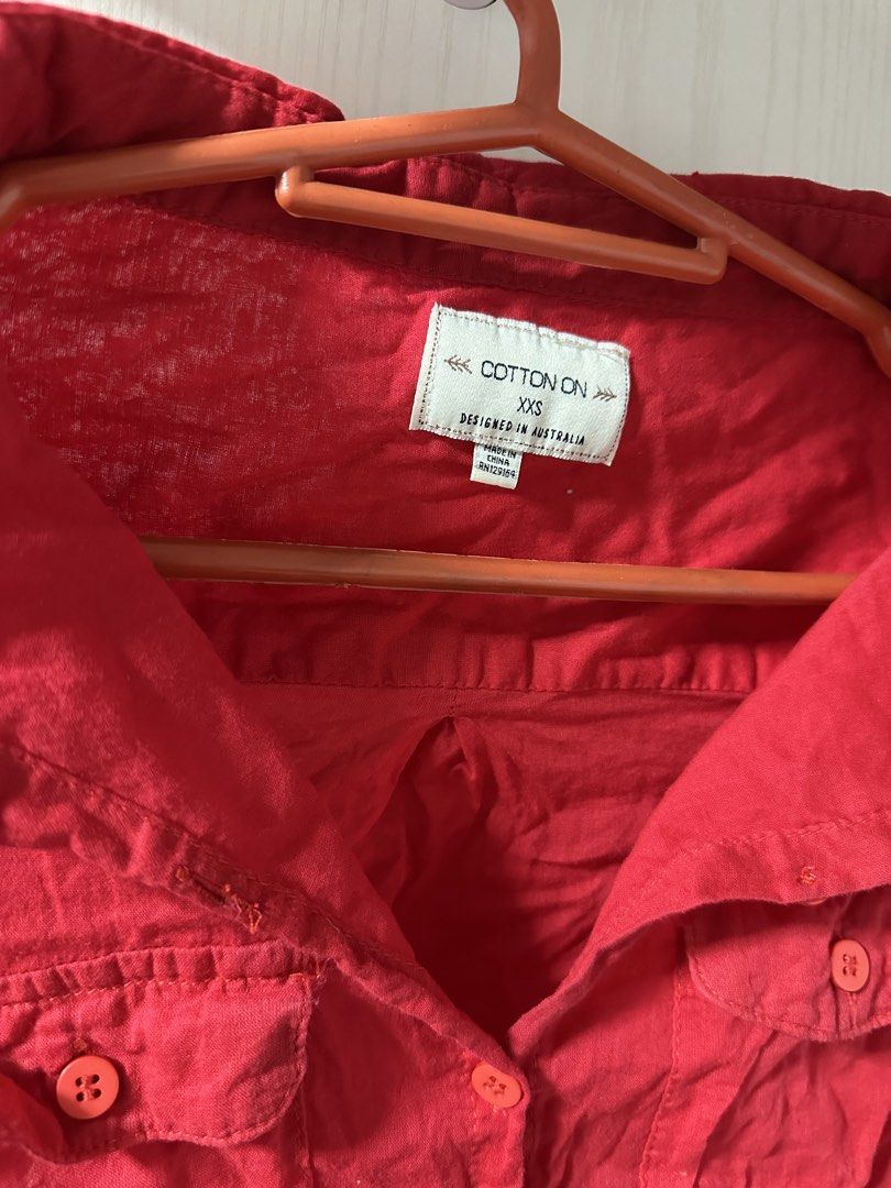 Cotton On Red Button-Down Shirt XXS-XS (Category: Blouses) located in Quezon City. Submitted by sunkissed.ph (Listing ID 1468141154, Image 2). Description: once used super tagal na nakatambak kaya gusot na and medyo luma looking xxs-xs cotton on ₱100.