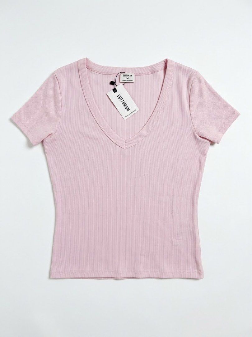 Cotton On Ribbed V-Neck Tee Light Pink Size M (Category: Shirts) located in Las Pinas. Submitted by dreas.thrift (Listing ID 1468199080, Image 1). Description: - Brand: Cotton On - Style: Ribbed V-neck tee - Color: Soft light pink - Fit: Slim fit with stretchy knit fabric - Condition: Brand new with tags attached, never worn.