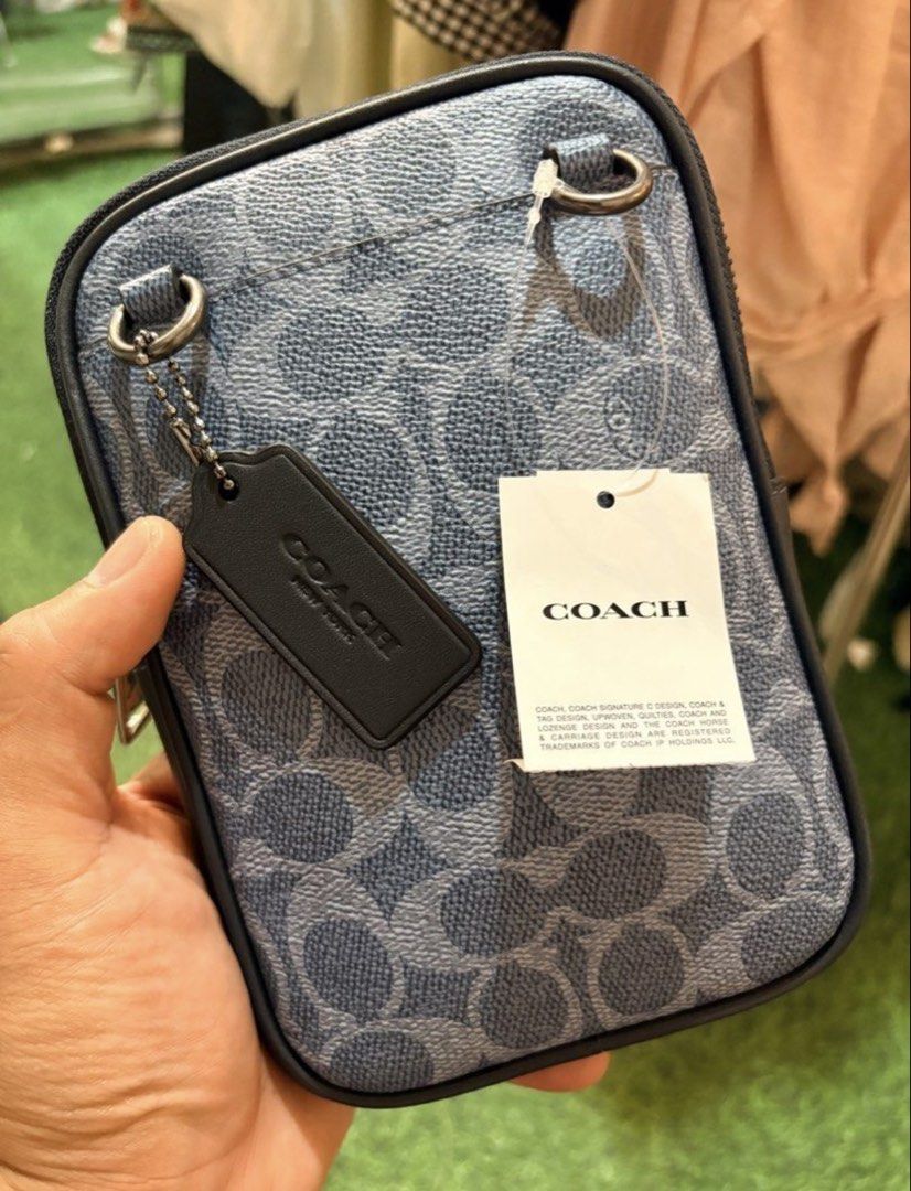 Coach Aden Crossbody bag (Category: Cross-body Bags) located in Manila. Submitted by josh2295 (Listing ID 1468279717, Image 1). Description: This Coach Aden Crossbody Bag in Signature Canvas (Style CW364) is a compact, vertical sling/phone bag designed for sleek everyday utility..