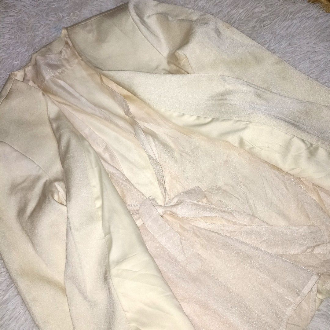 Cream Coat (Category: Coats, Jackets and Outerwear) located in Manila. Submitted by goldenmountain.e4137d (Listing ID 1468185030, Image 2). Description: Used Twice. Just a few stains, wash can do. Buttons are complete. With shoulder Pads. Half Lining. Large to Extra Large..