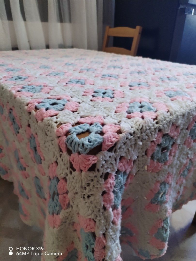 Crochet Table Topper ( 65 x 80 inches) (Category: Table Linen & Textiles) located in Muntinlupa City. Submitted by arciagamaryann68 (Listing ID 1468099629, Image 2). Description: - Item: Handmade Crochet Table Topper - Size: 65 x 80 inches - Design: Classic granny square / floral pattern in white, soft pink, and light blue - Condition: Excellent, clean, and well-kept - Ideal use: Dining table cover, living room centerpiece, or home decor accent.