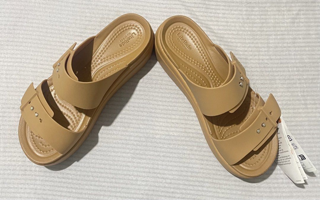 Crocs Brooklyn Buckle Low Wedge Sandals (Category: Flats & Sandals) located in Quezon City. Submitted by dtg30 (Listing ID 1468082634, Image 3). Description: - Brand: Crocs - 100% Authentic Crocs - Style: Brooklyn Buckle Low Wedge Sandals - Color: Tan - Condition: Brand new with tags (never worn) - Design: Two-strap with metallic button accents and adjustable buckle look - Comfort: Features plush LiteRide footbed for all-day wear - Heel: Wedge st