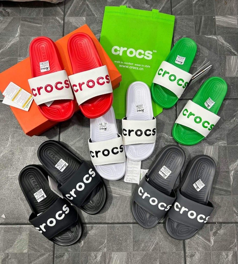 Crocs Classic Slides Multiple Colors and Sizes (Category: Slippers and slides) located in Manila. Submitted by qwerty.02 (Listing ID 1468082870, Image 2). Description: - Product: Crocs Slide Sandals with Graphic Prints - Colors Available: Black, White, Green, Red, Navy - Sizes Available: EU 40 to 45 - Comfort: Easy slip-on design featuring a textured footbed - Packaging: Brand new with original tags and box/bag - Note: Chat with us first to check