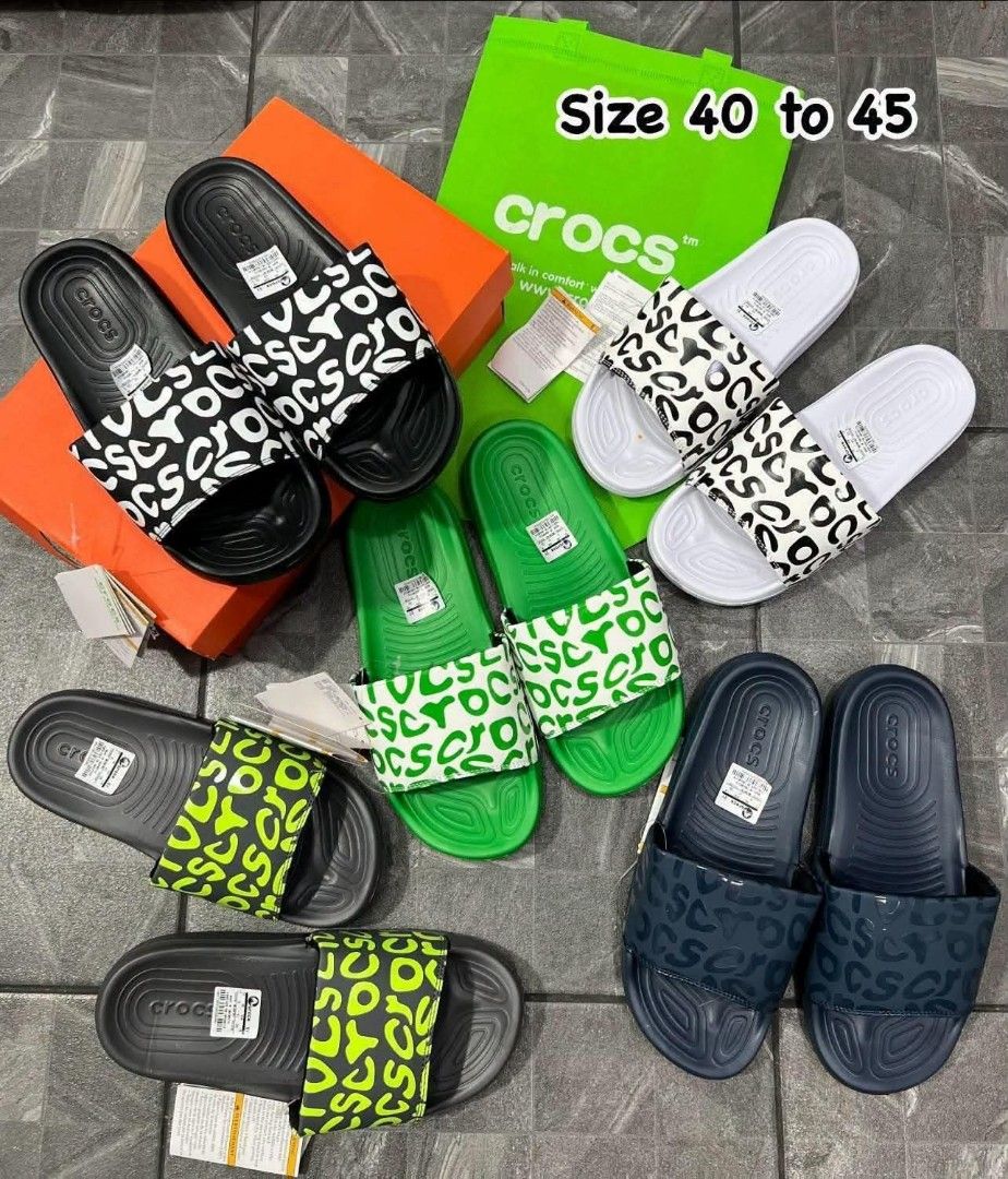 Crocs Classic Slides Multiple Colors and Sizes (Category: Slippers and slides) located in Manila. Submitted by qwerty.02 (Listing ID 1468082870, Image 1). Description: - Product: Crocs Slide Sandals with Graphic Prints - Colors Available: Black, White, Green, Red, Navy - Sizes Available: EU 40 to 45 - Comfort: Easy slip-on design featuring a textured footbed - Packaging: Brand new with original tags and box/bag - Note: Chat with us first to check