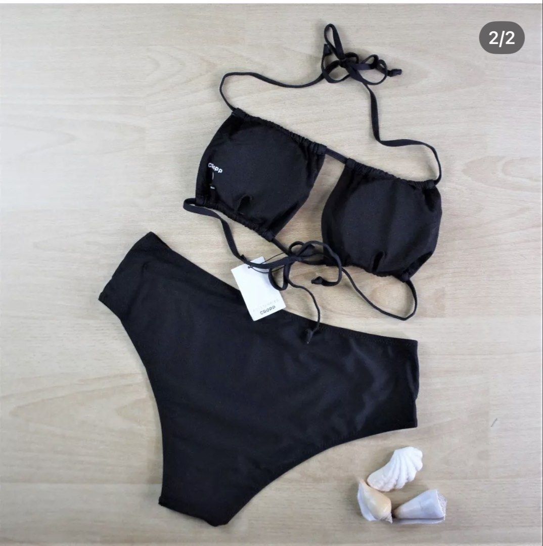 Cropp Black Bikini Swimwear Set Size L (Category: Bikinis & Swimsuits) located in Bulacan. Submitted by peach1025 (Listing ID 1468108426, Image 2). Description: - Brand: Cropp - Condition: Brand new with tags (never worn) - Size: L - Color: Classic solid black - Style: Halter neck top with adjustable string ties and high-waisted bottoms - Design: Minimal and versatile.