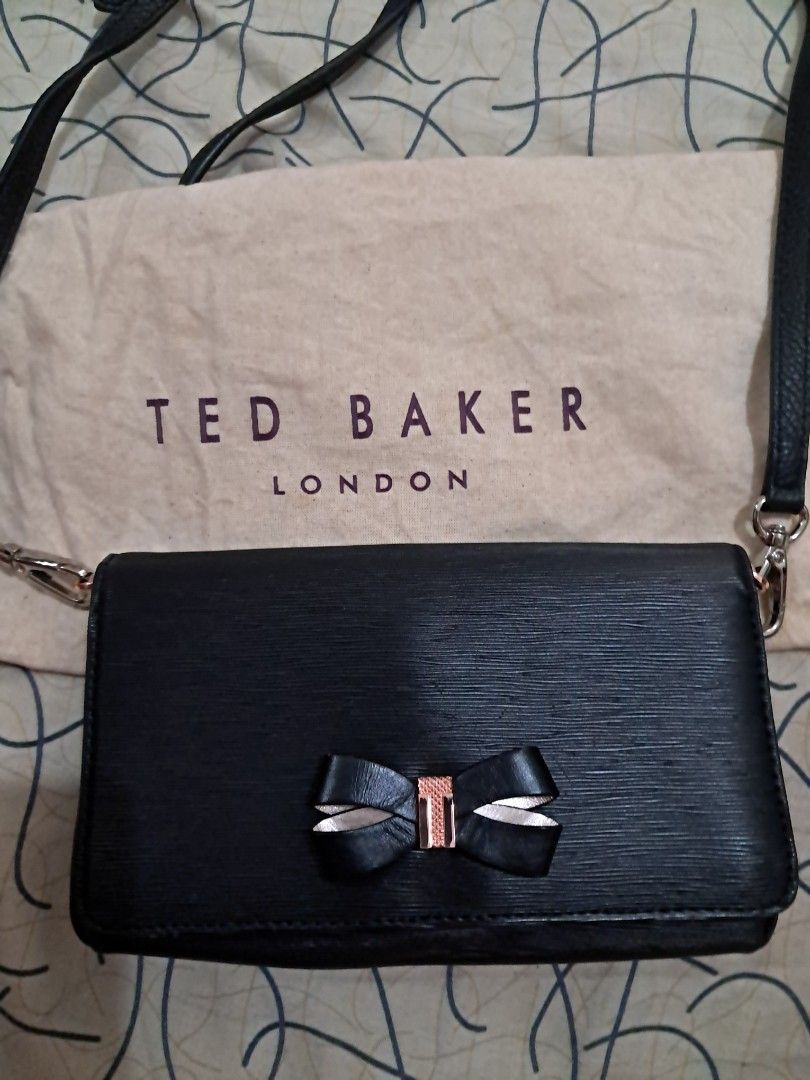 Crossbody bag Ted Baker London (Category: Cross-body Bags) located in Las Pinas. Submitted by shop2ship (Listing ID 1468100844, Image 2). Description: Ted Baker London crossbody bag strap is removable and adjustable with dustbag ribbon detail in front has 8 slots for cards with coin slots with zipper.