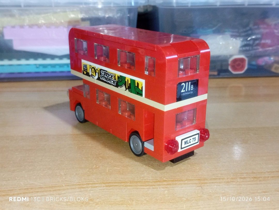 Custom Built London Double Decker Bus Brick Toy (Category: Vehicle & Diecast Models) located in Manila. Submitted by jynxpedrin39963 (Listing ID 1468218351, Image 3). Description: - Custom red double-decker bus building block set - Features unique stickers: 'THE BRICK SEPARATOR' and 'NOW'S THE TIME TO VISIT!' - Detailed with British flags, custom license plates, grey wheels, black front grille, and transparent windows - Excellent display piece fo
