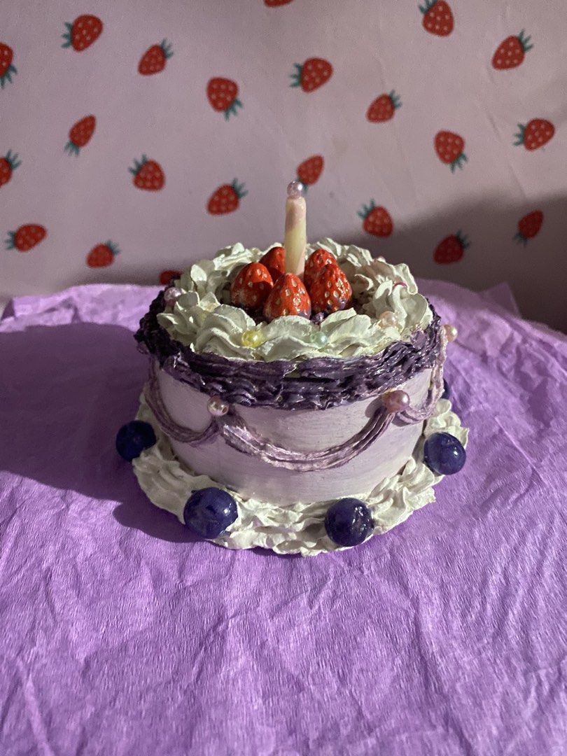 Custom Handmade Fake Cake Trinket Box (Category: Accessory Holder, Box & Organizers) located in Manila. Submitted by littleatorie.studio (Listing ID 1468235115, Image 2). Description: - Handmade clay fake cake trinket box with a removable lid - Custom-made - Decorated with piped white frosting, strawberries, pearls, blueberries, and a cute candle sculpture - Small size, ideal for aesthetic room decor or organizing tiny accessories like rings and 