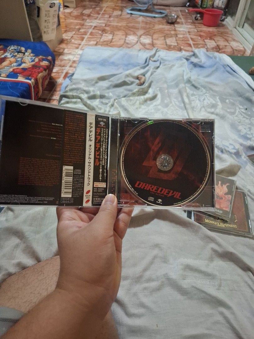 Daredevil The Album Soundtrack CD (Category: CDs & DVDs) located in San Jose del Monte. Submitted by youweiner48495 (Listing ID 1468141311, Image 2). Description: - Item: Daredevil Original Motion Picture Soundtrack CD - Condition: Excellent, clean and scratch-free disc surface - Packaging: Jewel case with cover insert and back tracklist - Featured Artists: Evanescence, Drowning Pool, Nickelback, Moby, and more - Perfect for: Rock music fans and 