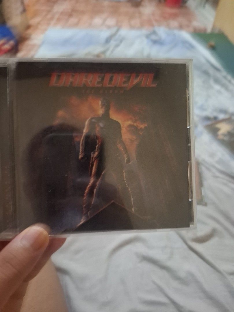 Daredevil The Album Soundtrack CD (Category: CDs & DVDs) located in San Jose del Monte. Submitted by youweiner48495 (Listing ID 1468141311, Image 1). Description: - Item: Daredevil Original Motion Picture Soundtrack CD - Condition: Excellent, clean and scratch-free disc surface - Packaging: Jewel case with cover insert and back tracklist - Featured Artists: Evanescence, Drowning Pool, Nickelback, Moby, and more - Perfect for: Rock music fans and 