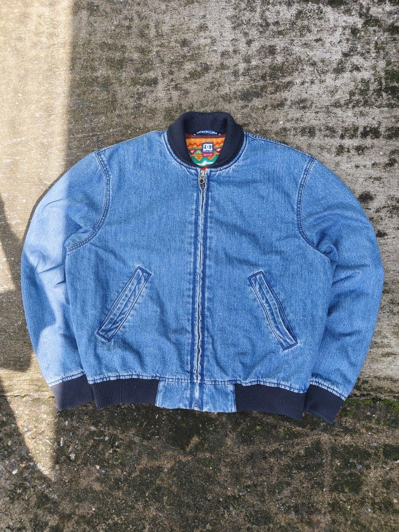 DC Shoes Men's TFunk Denim Bomber Jacket (Category: Coats, Jackets and Outerwear) located in Manila. Submitted by roycejoy (Listing ID 1468184535, Image 2). Description: DC Shoes Men's TFunk Denim Bomber Jacket with a blue denim exterior and a colorful patterned fleece lining Size medium W25 L26. 5 No issue.