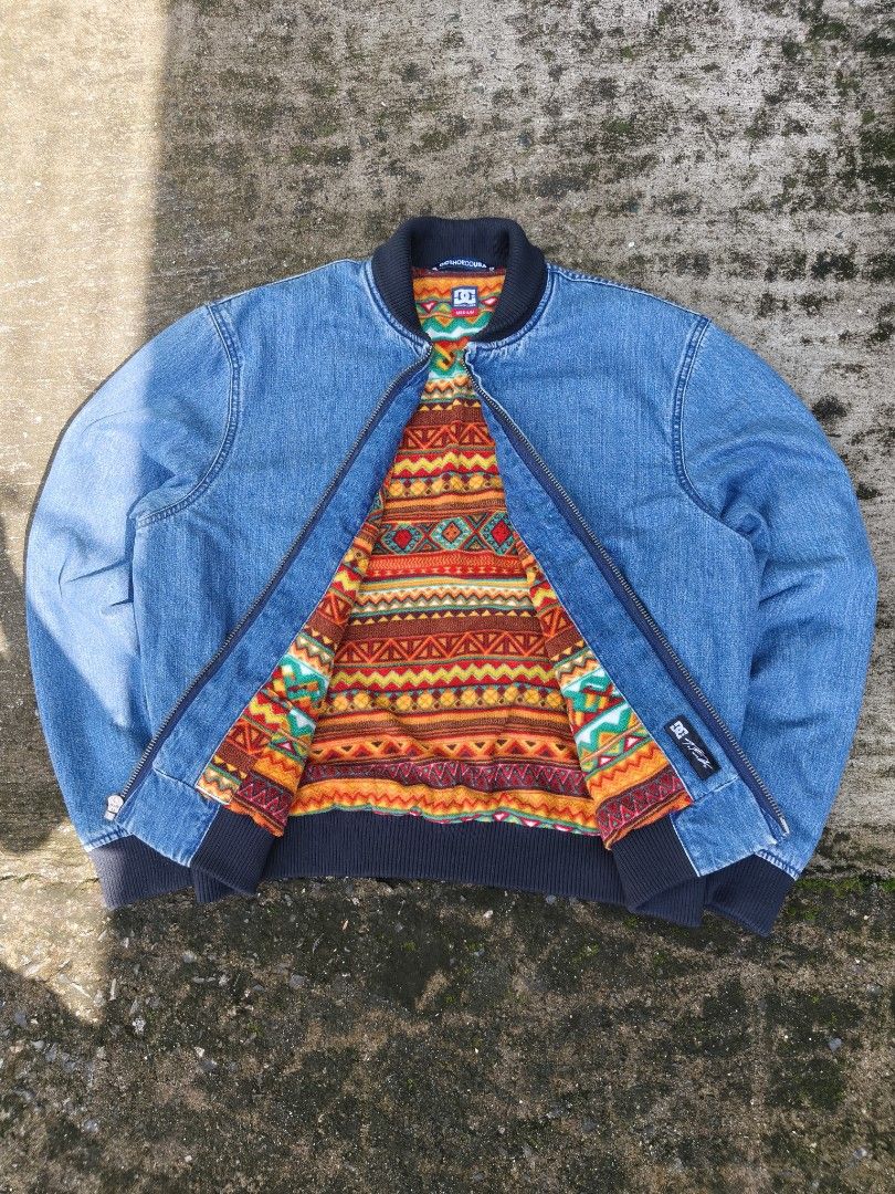 DC Shoes Men's TFunk Denim Bomber Jacket (Category: Coats, Jackets and Outerwear) located in Manila. Submitted by roycejoy (Listing ID 1468184535, Image 1). Description: DC Shoes Men's TFunk Denim Bomber Jacket with a blue denim exterior and a colorful patterned fleece lining Size medium W25 L26. 5 No issue.