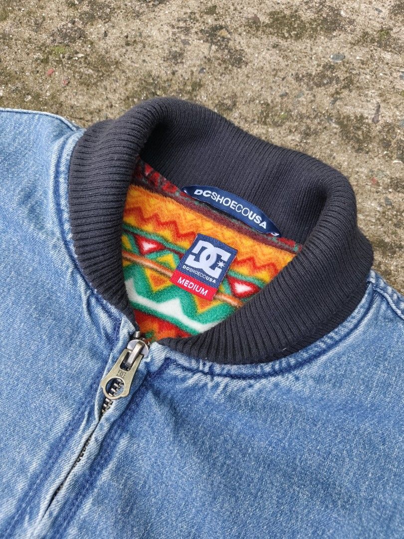 DC Shoes Men's TFunk Denim Bomber Jacket (Category: Coats, Jackets and Outerwear) located in Manila. Submitted by roycejoy (Listing ID 1468184535, Image 3). Description: DC Shoes Men's TFunk Denim Bomber Jacket with a blue denim exterior and a colorful patterned fleece lining Size medium W25 L26. 5 No issue.