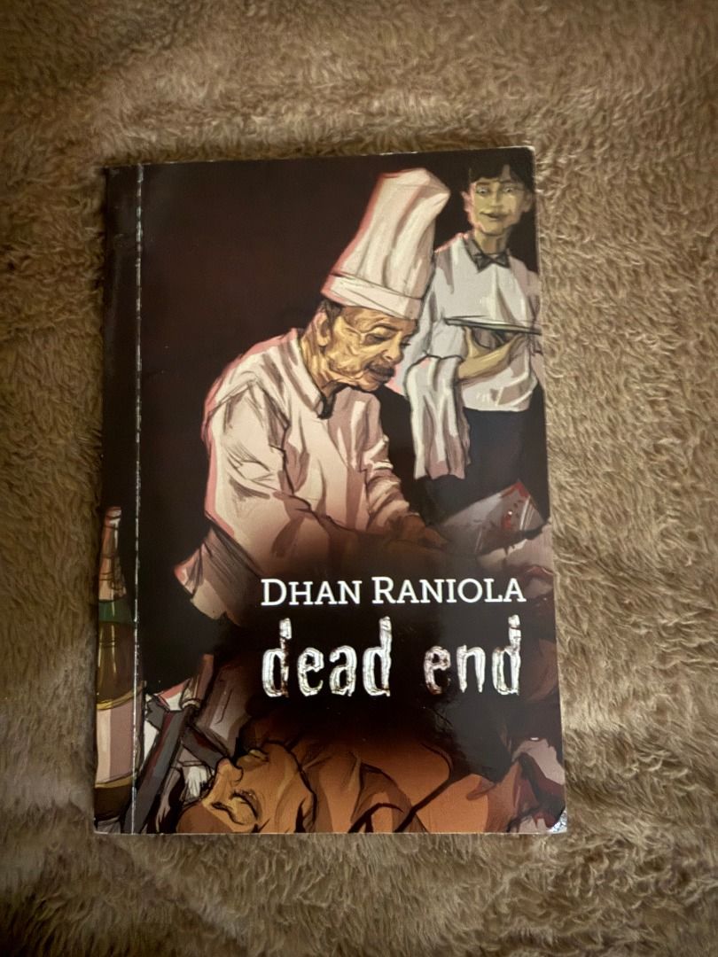 Dead End by Dhan Raniola novel book (Category: Storybooks) located in Manila. Submitted by bellevuebooks (Listing ID 1468235526, Image 1). Description: Dead End novel written by Dhan Raniola. Softcover edition. Cover illustration features a chef, a waiter, and a dark scene. Clean pages inside, minimal edge wear on the spine and corners. Great read for mystery or thriller fans..