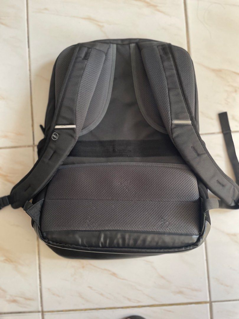Dell Black Laptop Backpack (Category: Backpacks) located in Pasig City. Submitted by khaleisi (Listing ID 1468103340, Image 2). Description: - Brand: Dell - Color: Classic black with a stylish blue interior lining - Storage: Multiple zippered compartments and organized pen loops - Comfort: Padded shoulder straps and back panel for all-day ease - Design: Sleek debossed Dell logo on the front pocket - Durability: Tough, water-resistant base materia