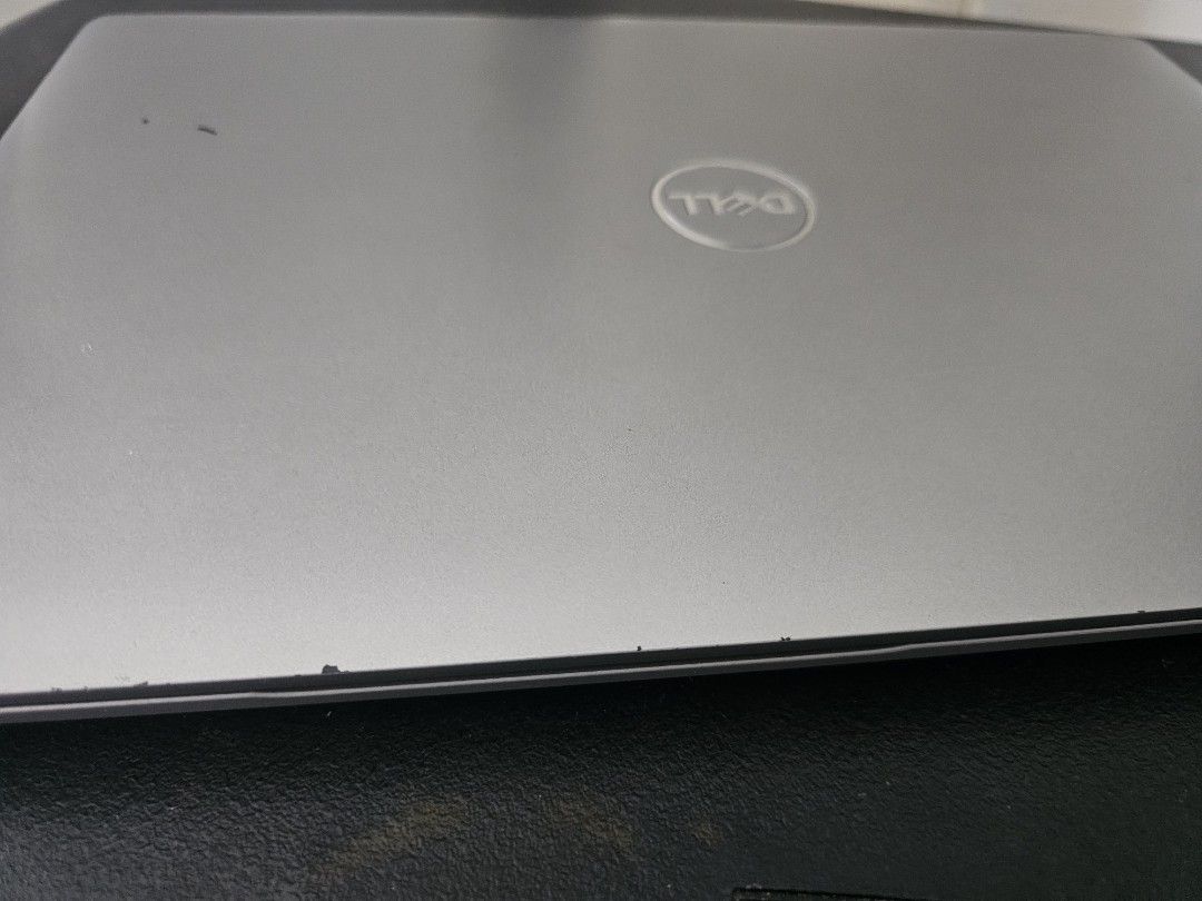 Dell Laptop Silver (Category: Laptops & Notebooks) located in Makati City. Submitted by ginashy (Listing ID 1468096432, Image 1). Description: some gasgas and peel off rubber side of the screen (check on the picture) loc: makati.