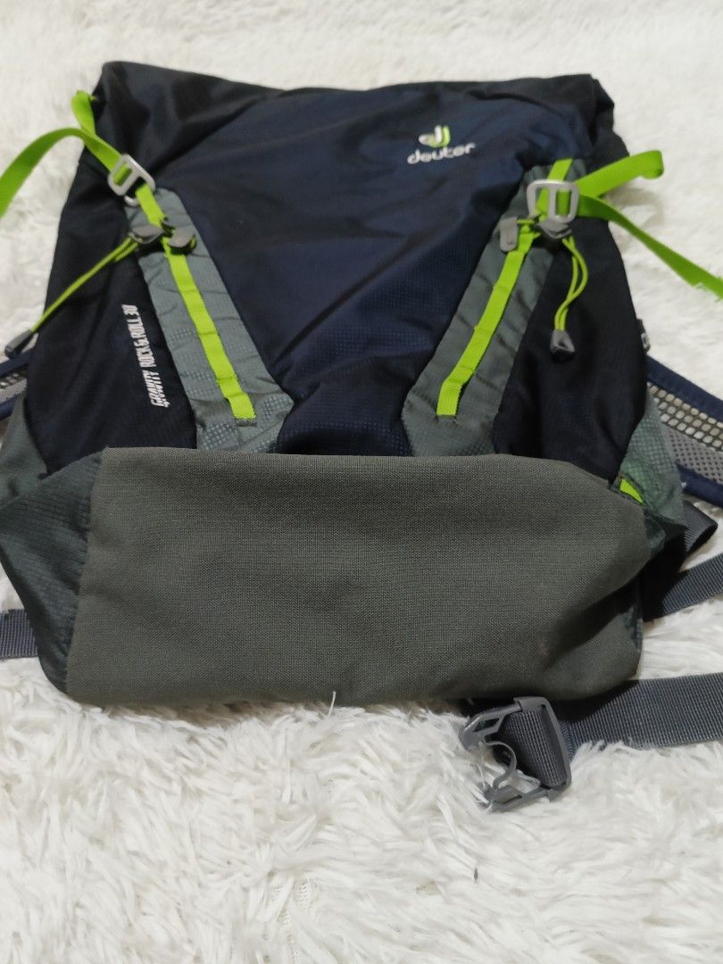 Deuter Gravity Rock and Roll 30 Backpack (Category: Backpacks) located in Quezon City. Submitted by jdwoah12 (Listing ID 1468070220, Image 2). Description: - Brand: Deuter Model: Gravity Rock and Roll 30 - Color: Navy blue and grey with bright green accents - Design: Roll-top with adjustable straps and secure buckles - Comfort: Breathable mesh shoulder straps - Condition: Clean exterior and interior, excellent ready-to-use condition - Versatility