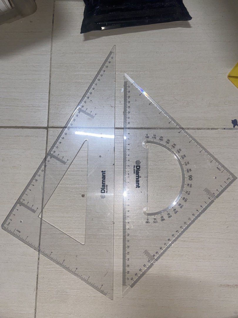Diamant Triangle Ruler Set No.6540 40cm (Category: Stationery & School Supplies) located in Manila. Submitted by jvpd31 (Listing ID 1468086443, Image 2). Description: - Brand/Model: Diamant 6540 - Size: 40cm base, 37cm height - Measurements: Inches and centimeters - Inclusions: Ruler, protractor, and triangles in original plastic packaging - Ideal for: Drafting, drawing, and school projects - Distributor: Standard Overseas (Quezon City) - Origin: