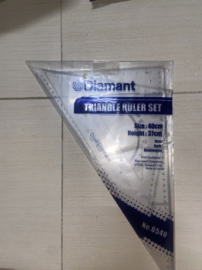 Diamant Triangle Ruler Set No.6540 40cm (Category: Stationery & School Supplies) located in Manila. Submitted by jvpd31 (Listing ID 1468086443, Image 1). Description: - Brand/Model: Diamant 6540 - Size: 40cm base, 37cm height - Measurements: Inches and centimeters - Inclusions: Ruler, protractor, and triangles in original plastic packaging - Ideal for: Drafting, drawing, and school projects - Distributor: Standard Overseas (Quezon City) - Origin: