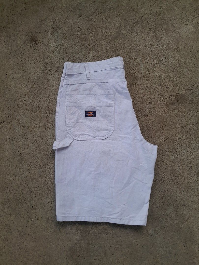 Dickies Dunn-Edwards Paints White Carpenter Shorts (Category: Shorts) located in Bayabas. Submitted by justhriftwithme (Listing ID 1468068531, Image 1). Description: - Brand: Dickies x Dunn-Edwards Paints - Style: White carpenter shorts with vintage look - Features: Rare back pocket collaboration patch, classic hammer loop, and utility pockets - Hardware: Button closure with embossed logo branding - Material: Durable cotton canvas - Fit: Great st