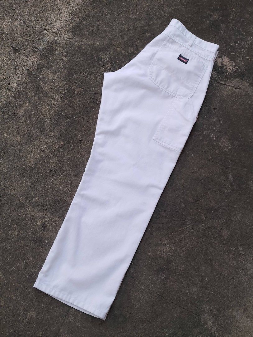 Dickies White Painter Utility Cargo Pants (Category: Jeans) located in Bago City. Submitted by the_outcast6101 (Listing ID 1468278293, Image 2). Description: - Brand: Dickies - Style: White carpenter work pants with side pockets, hammer loop, and iconic logo patch - Fit: Classic relaxed fit - Material: Heavy-duty cotton duck - Condition: Noticeable paint stains near the front knee area (as pictured) - Perfect for: Painting, skating, or streetwear
