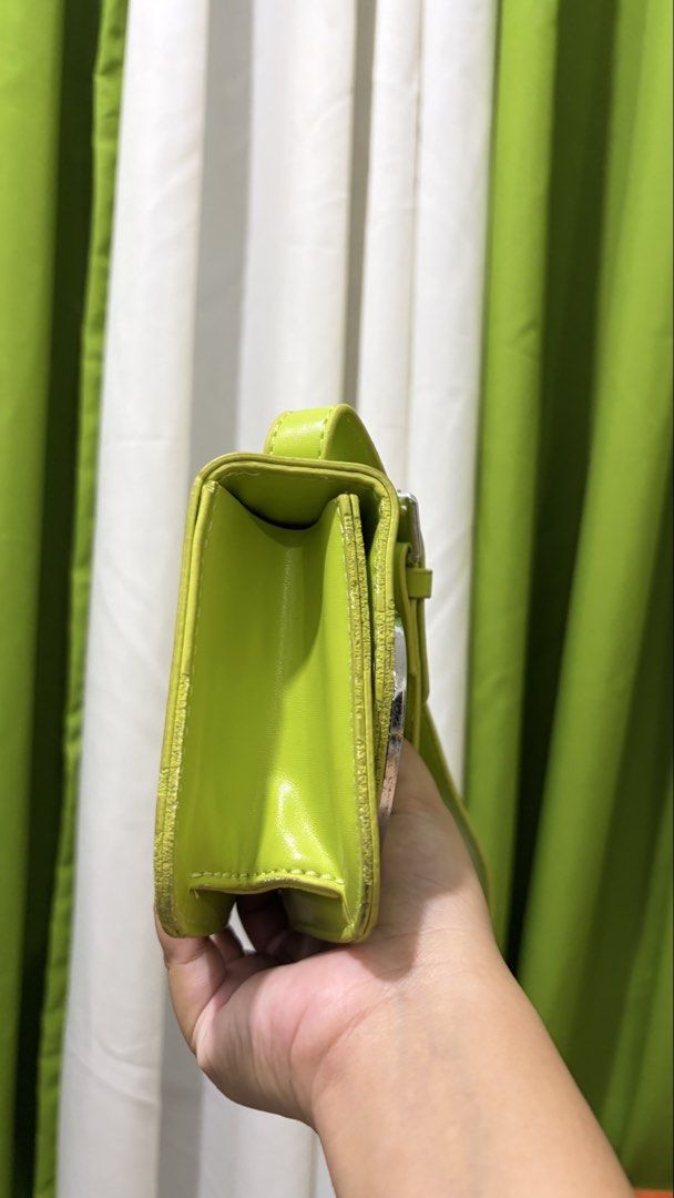 Diesel Flourescent Green Shoulder Bag (Category: Luxury Bags & Wallets) located in Manila. Submitted by wandathescarletwitch (Listing ID 1468059724, Image 2). Description: - Brand: Diesel - Color: Flourescent green - Hardware: Silver-tone - Details: Signature metal D logo plate on flap closure, smooth finish - Strap: Adjustable matching strap - Shape: Compact rectangular.