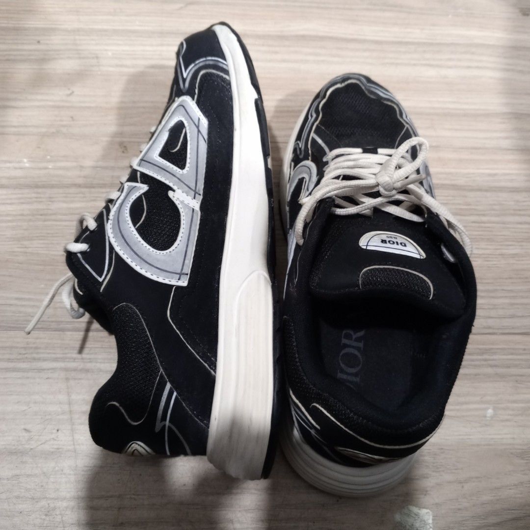 Dior B30 Countdown Sneakers (Category: Sneakers & Footwear) located in Legazpi City. Submitted by Love_Maya (Listing ID 1468231572, Image 3). Description: - Brand: Dior - Model: B30 Sneakers - Colorway: Black and white with reflective grey accents - Features: Chunky sole style, breathable mesh panels, white laces, and signature CD logo on sides, heel, and outsole - Condition: Normal signs of wear on the soles and midsoles from previous use - Meet