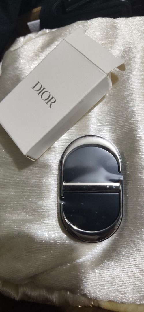 Dior CD Compact Pocket Mirror (Category: Makeup) located in Caloocan City. Submitted by refreshmycloset444 (Listing ID 1468247534, Image 1). Description: - Authentic Dior compact mirror - Elegant black and silver design with CD logo on the front - Double-sided mirror on the inside - Equipped with a 3M adhesive sticker on the back for mounting - Includes original white box - Condition: Excellent / Brand New - Perfect for gifts or personal use.