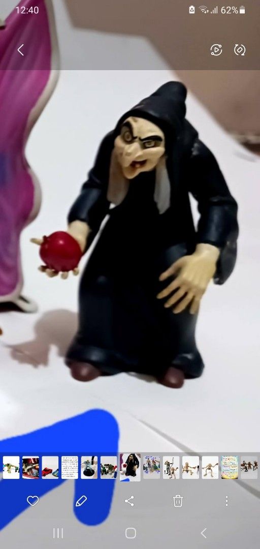 Disney Snow White Evil Queen Witch Figure (Category: Figurines & Statues) located in Mandaluyong City. Submitted by winniepeds22722 (Listing ID 1468248171, Image 1). Description: - Authentic Disney Evil Queen figurine featuring the iconic Old Hag holding the poisoned apple - Highly detailed sculpt showcasing her dark hooded cloak and wrinkled face - Stands upright on its own, perfect for display - Must-have collectible piece for Disney fans and v