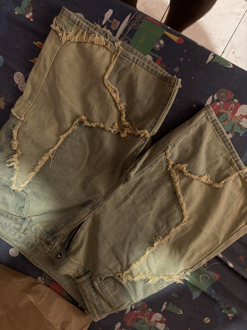 Distressed Patchwork Denim Shorts Raw Edge Vintage Wash (Category: Shorts) located in Antipolo. Submitted by haroldjaymagno (Listing ID 1468175054, Image 1). Description: - Style: Casual streetwear denim shorts with heavy patchwork - Details: Star-shaped contrast panels, raw frayed edges, light blue & beige wash - Fit: Mid-rise waist, zipper fly with button closure, five-pocket styling - Condition: Unworn (tags removed) - Perfect for effortless, 