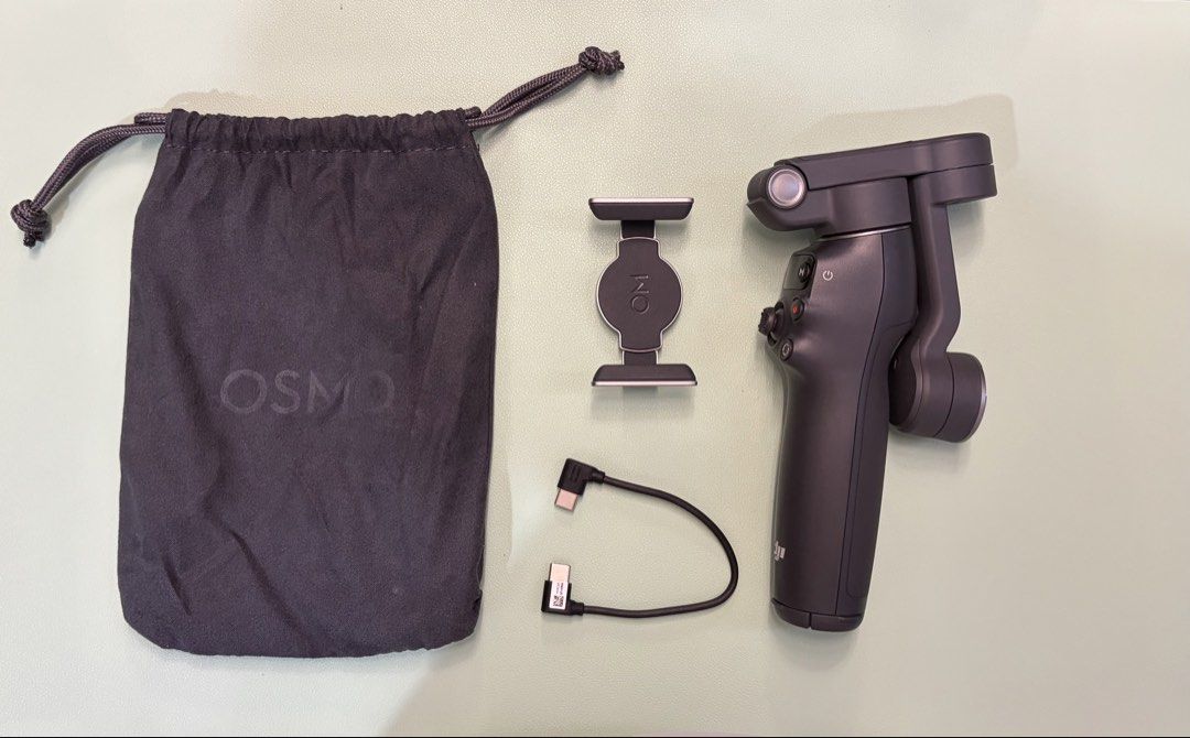 DJI Osmo Mobile 7P Smartphone Stabilizer (Category: Gimbals & Stabilizers ) located in Quezon City. Submitted by refittedph (Listing ID 1468234713, Image 2). Description: DJI Osmo Mobile 7P smartphone stabilizer. Complete set includes gimbal unit, magnetic phone clamp, USB-C charging cable, and drawstring storage pouch. Original box included. Everything in good condition. No dents and scratches..