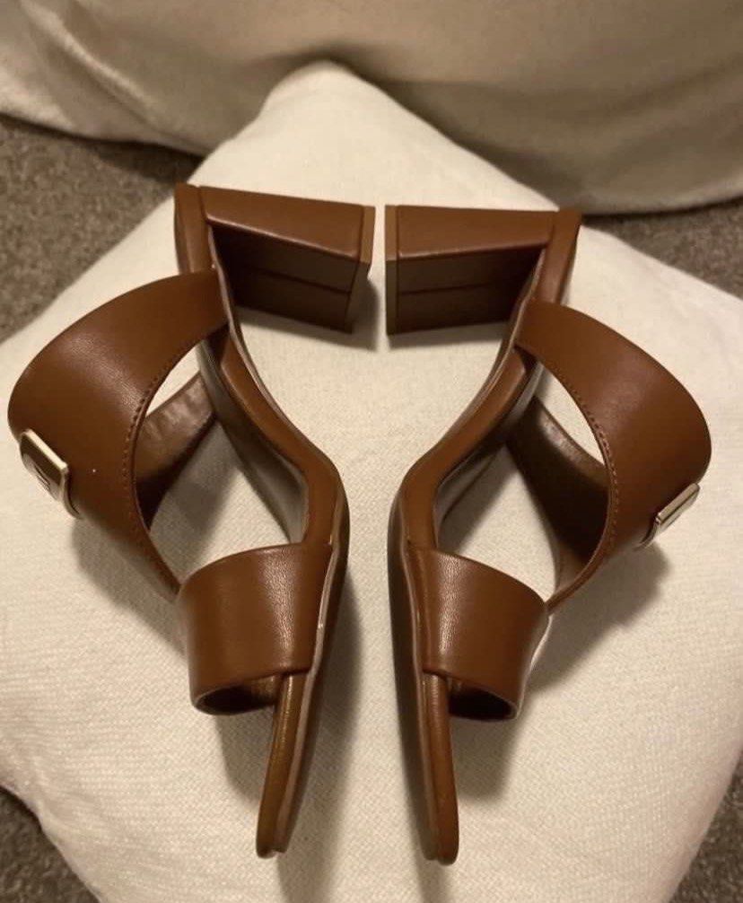 DKNY Brown Block Heel Mules Sandals US 7M (Category: Flats & Sandals) located in Muntinlupa City. Submitted by hollieberrygirl (Listing ID 1468124708, Image 3). Description: DKNY Brown Slip-on Open Toe Sandals w/ Heels Store bought in Australia Size 7 w/ 3” heels Price - P5,995 SF c/o buyer Seller is not responsible for anything that happens to the item after purchase..