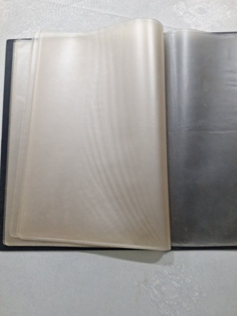 Document Folder - 10 pockets (Category: Stationery & School Supplies) located in Singapore. Submitted by jane101929 (Listing ID 1468239054, Image 4). Description: Black document folder with gold embossed Great Eastern Life logo on front. Includes clear plastic sleeves inside for organizing papers or certificates. Clear pocket slot on front cover for label insertion. Professional corporate item. Good for keeping documents neat and tidy. Hard cover