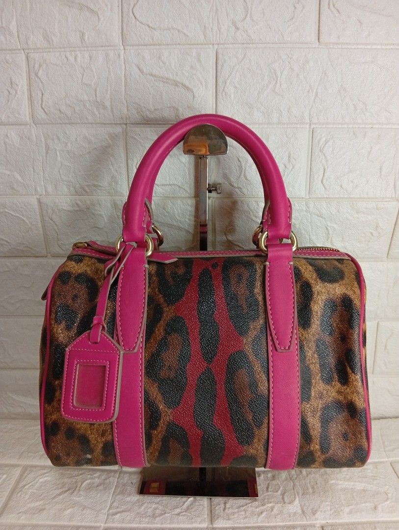 Dolce & Gabbana leopard-Print Boston Bag (Category: Shoulder Bags) located in Las Pinas. Submitted by etoksi1234 (Listing ID 1468064330, Image 1). Description: Dolce & Gabbana leopard-print boston bag / satchel featuring vibrant pink (or magenta/red) leather trim and top handles..