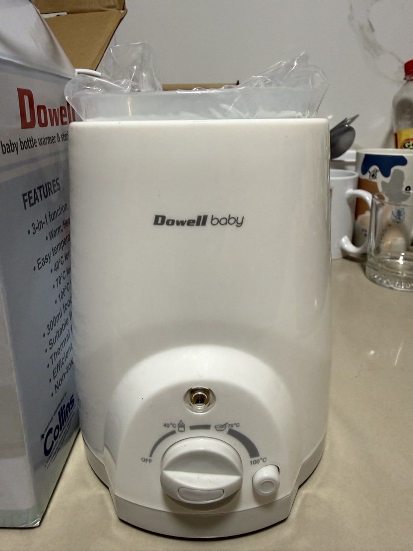 Dowell Baby Bottle Warmer & Sterilizer BWS-009 (Category: Breastfeeding & Bottle Feeding) located in Quezon City. Submitted by thedonnacn (Listing ID 1468222769, Image 1). Description: Dowell baby bottle warmer and sterilizer, model BWS-009. 3-in-1 function including warm, heat, and sterilize. Easy temperature settings from 40 degrees C to 100 degrees C. Includes original box, manual, and inner plastic wrap. 230V, 60Hz. Never used, stored in box.