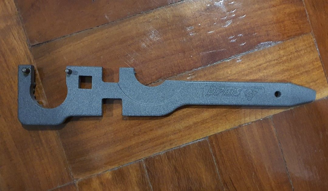 DPMS AR-15 Armorers Wrench Multi-Tool (Category: Construction Tools & Equipment) located in Pasay City. Submitted by rsar888 (Listing ID 1468133835, Image 2). Description: - Genuine DPMS armorer's wrench for AR-15 assembly and maintenance - Heavy-duty steel construction with a durable textured grey finish - Built-in slots for standard barrel nuts and castle nuts - Integrated square cutout compatible with torque wrenches - Features the authentic s