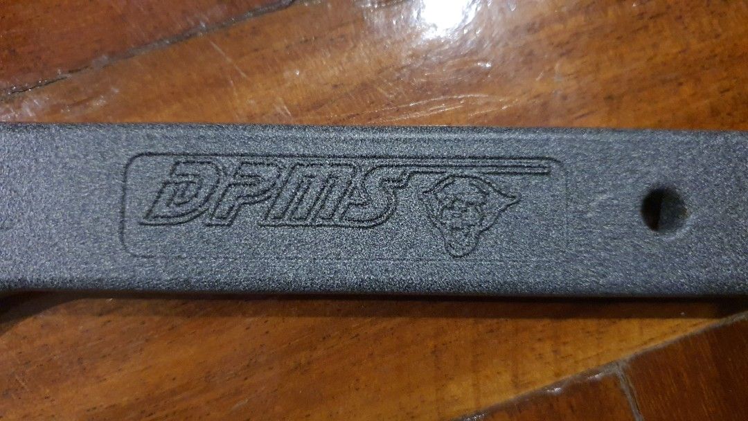 DPMS AR-15 Armorers Wrench Multi-Tool (Category: Construction Tools & Equipment) located in Pasay City. Submitted by rsar888 (Listing ID 1468133835, Image 1). Description: - Genuine DPMS armorer's wrench for AR-15 assembly and maintenance - Heavy-duty steel construction with a durable textured grey finish - Built-in slots for standard barrel nuts and castle nuts - Integrated square cutout compatible with torque wrenches - Features the authentic s